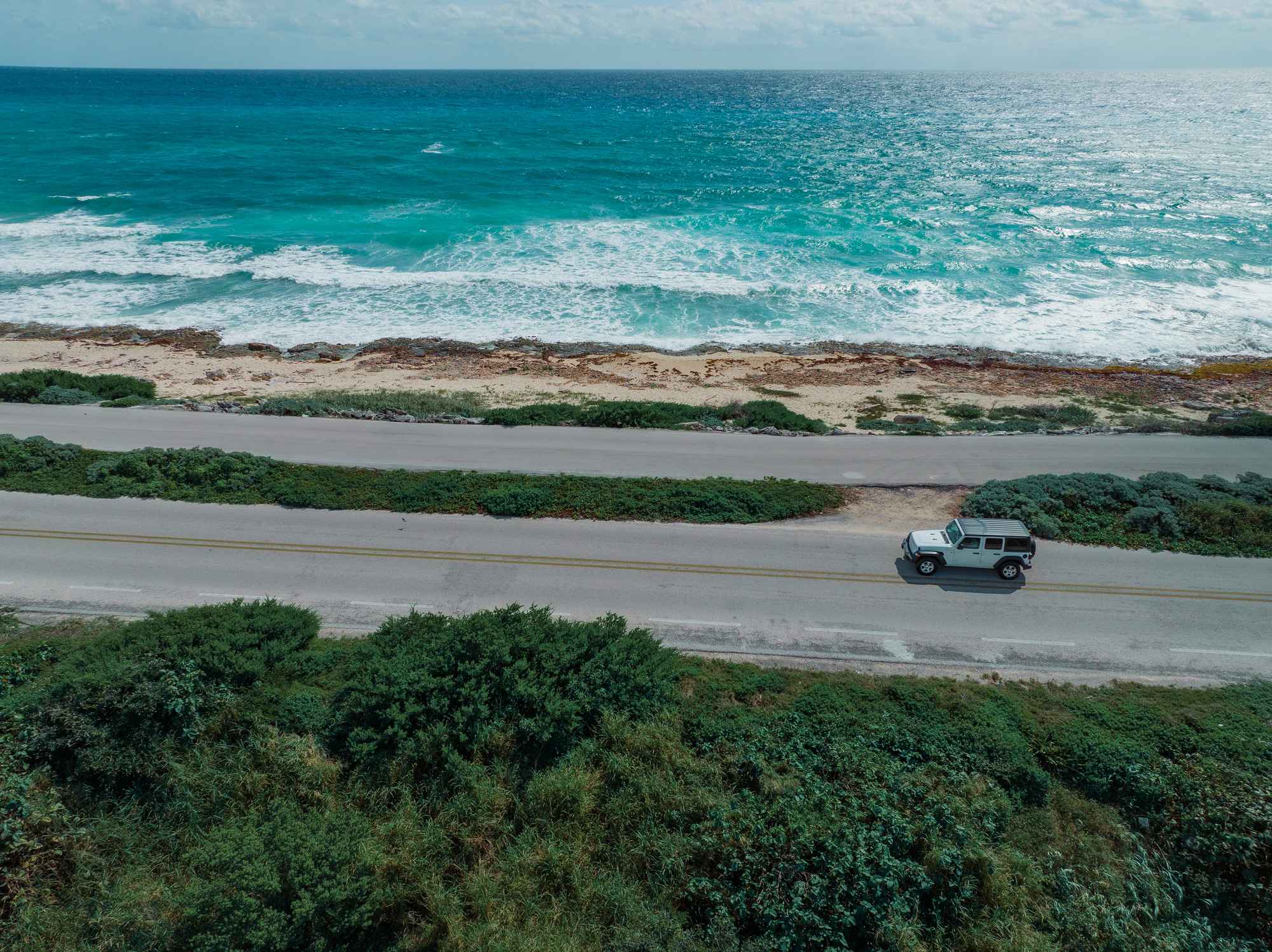 aerial view of car on road on cozumel Island
